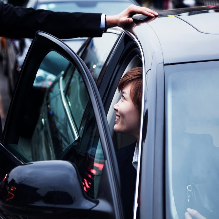 businessman-opening-car-door-for-businesswoman-dur-2024-10-23-08-32-05-utc-1.jpg
